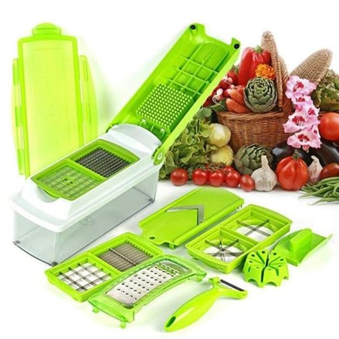 Green vegetable chopper with multiple attachments on a white background